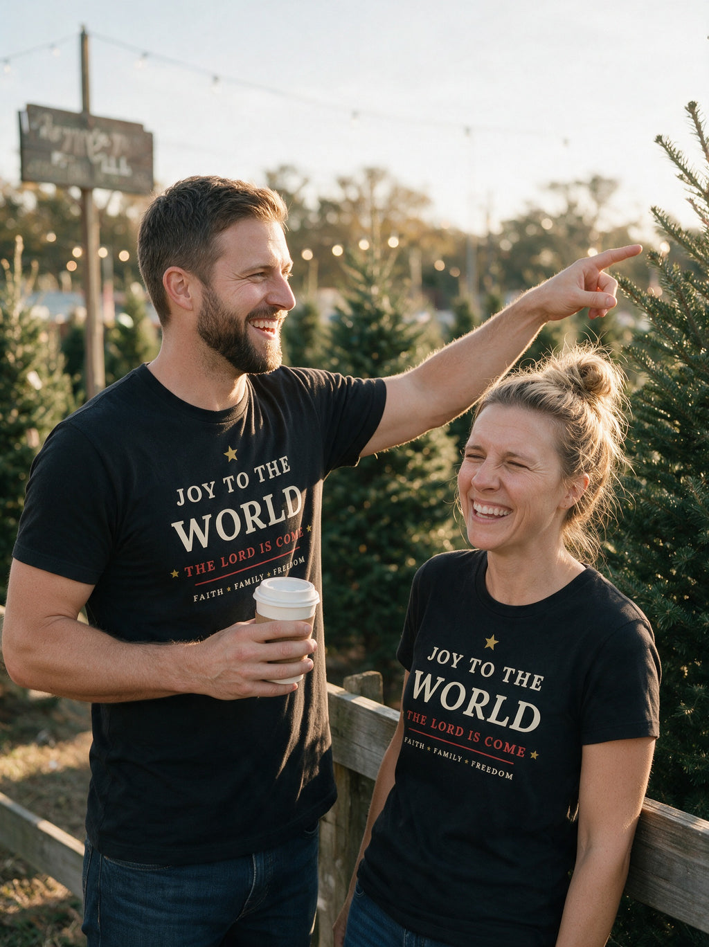 Couple in black Joy to the World Christmas tees at a Christmas tree lot at golden hour (AI-generated)