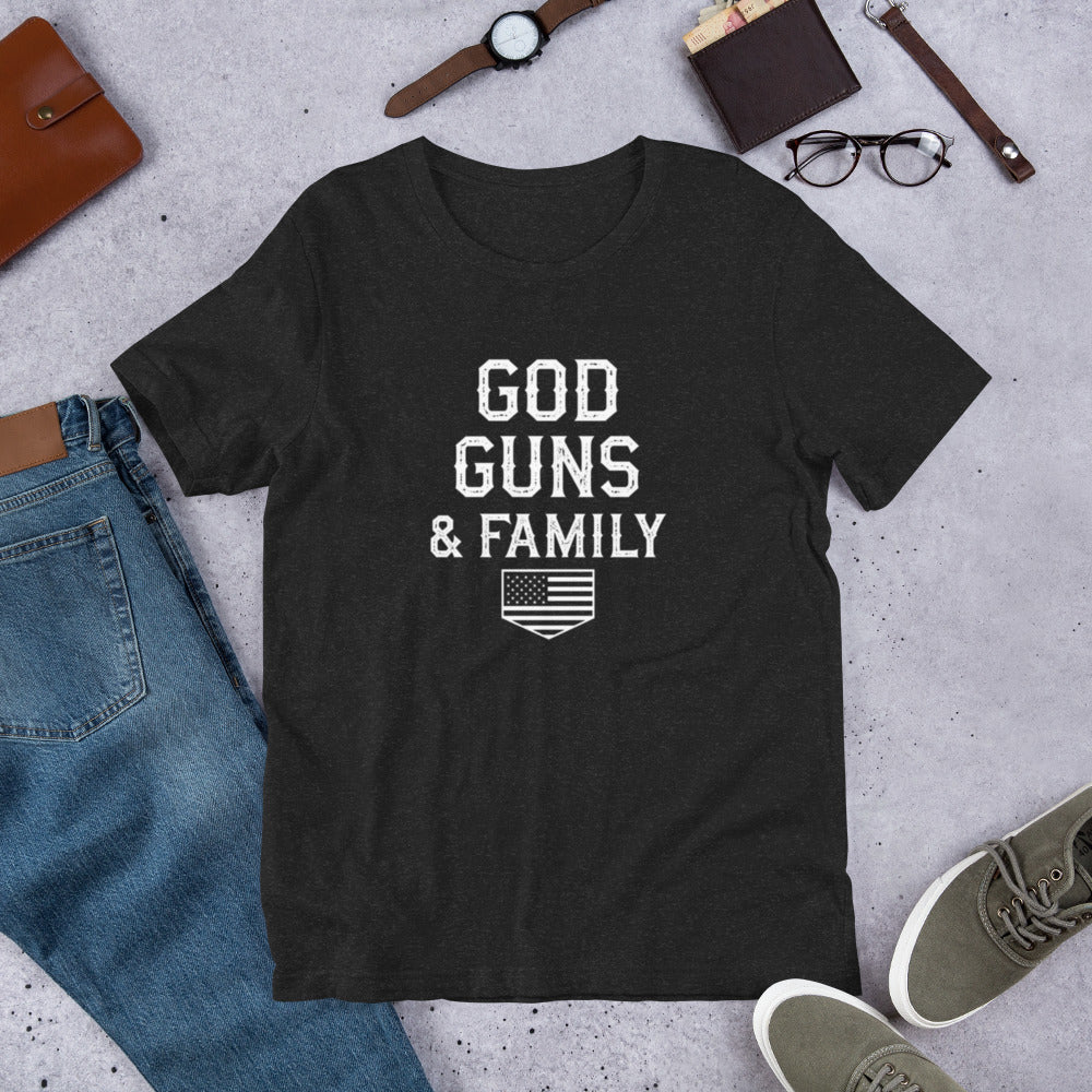 God, Guns, & Family Classic Tee in black heather, flat lay with jeans and accessories