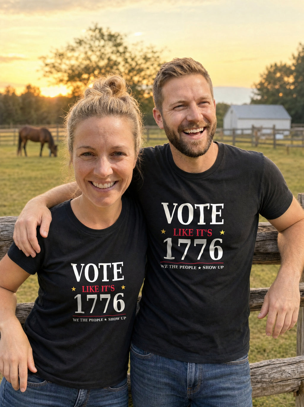 Couple in black Vote Like It's 1776 tees at a pasture fence at sunset